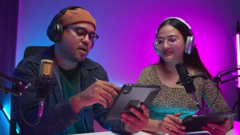 Two young asian streamer host making live podcast at broadcast home studio.  Stock Footage 289542763