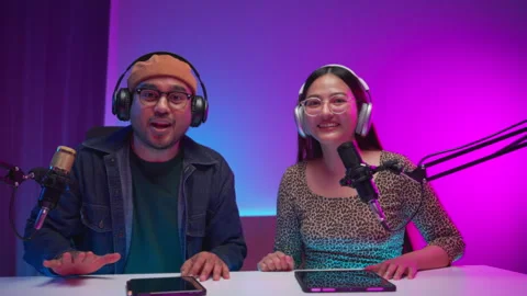 Two young asian streamer host making live podcast at broadcast home studio.  Stock Footage 289543112