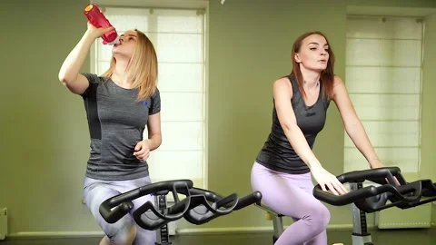 Two young attractive women doing cardio workout in the gym. Stock Footage 101631144
