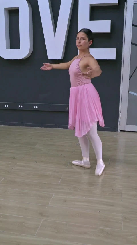 Two Young Ballet Dancers Practicing in a Dance Studio Wearing Tutus. 動画素材 334884741