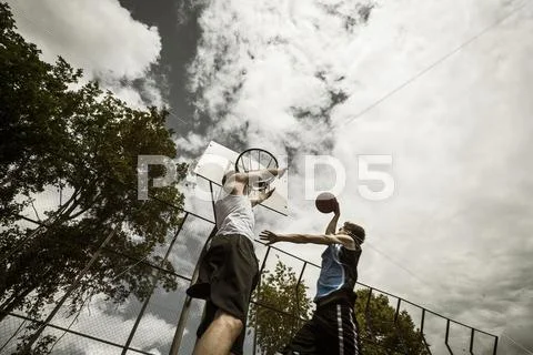 Two Young Basketball Players At Duel