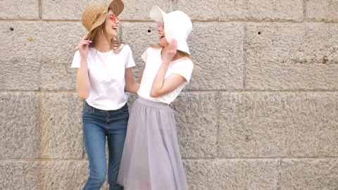 Two young beautiful blond smiling hipster girls Stock Footage 141217680