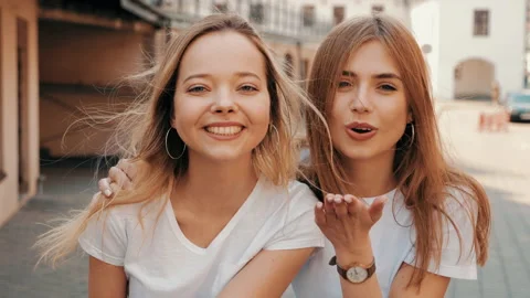 Two young beautiful blond smiling hipster girls Stock Footage 141221194