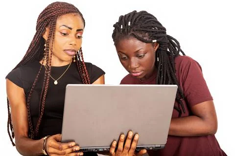 Two young beautiful sisters using a laptop Foto stock