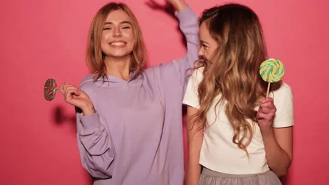 Two young beautiful smiling blond hipster girls Stock Footage 140519872