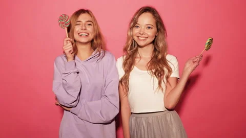 Two young beautiful smiling blond hipster girls Stock Footage 140520432