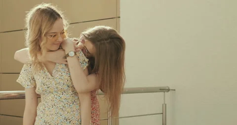 Two young beautiful smiling hipster girls in trendy summer sundress Stock Footage 142273045