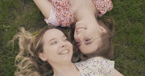Two young beautiful smiling hipster girls Stock Footage 142274596