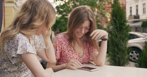 Two young beautiful smiling hipster girls Stock Footage 142277121