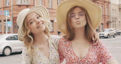 Two young beautiful smiling hipster girls Stock Footage 142278232