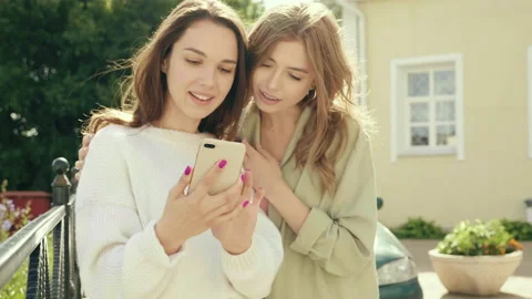 Two young beautiful smiling hipster girls.Sexy carefree women Stock Footage 142556576