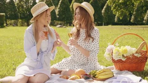 Two young beautiful smiling hipster girls in trendy summer sundress Stock Footage 142560080