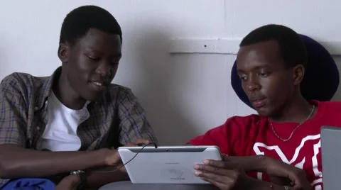 Two young black guys using a tablet in Africa Video stock 47850070