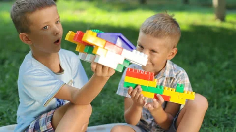 Two young boys playing with the designer Stock Footage 26181708