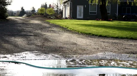 Two young boys playing in mud puddle Stock-Footage 62278557