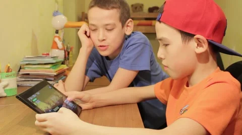 Two Young Boys Using Digital Tablet Together Vídeo Stock 47344973