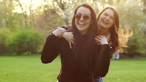 Two young brunettes go camping Stock Footage