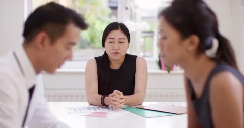 Two young business colleagues having a disagreement during a board meeting. Stock Footage 58764587