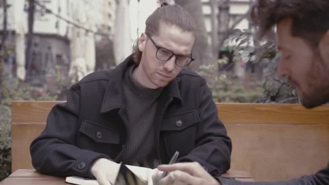 Two young business men having a meeting Stock Footage 152534336