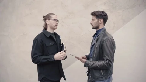 Two young business men talking Video stock 152534419