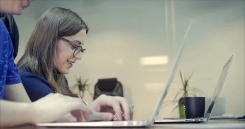 Two Young business people using computer in the office. Two decorator's Stock Footage 103953022