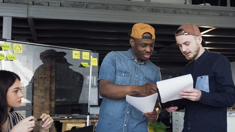 Two young businessman shaking hands after productive work day in the office. Stock Footage 108400952