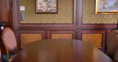 Two young businessmen chief sit down at the negotiating table. Negotiate Stock Footage 113920008