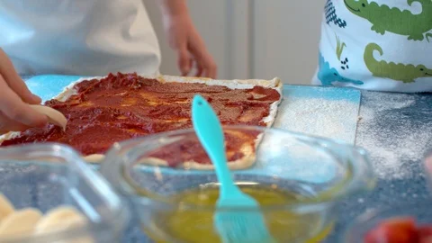 Two young chefs cooking pizza Stock Footage 124853384