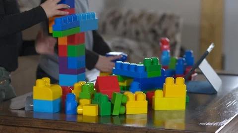 Two young children playing with building blocks with tablet Stock Footage 85489738