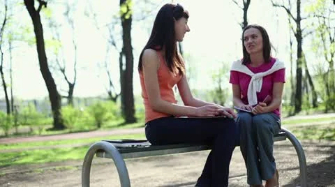 Two young college students talking in school campus, tracking shot HD Stock Footage 11054555