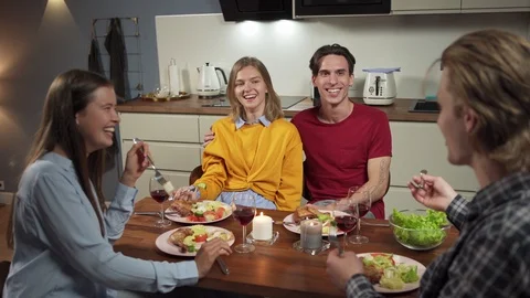 Two young couple gathering for dinner Stock Footage 114811178