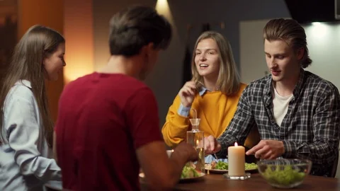 Two young couples dining together Stock Footage 114813414