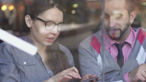 Two young, creative and business people in a cafe Stock-Footage 85224334