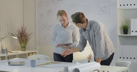 Two young creative designers work in the office on the project Stock Footage 81667394