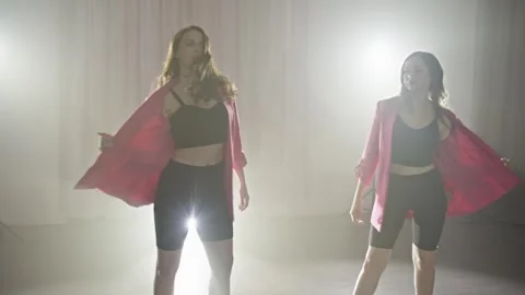 Two young dancers dance in beautiful light. Stock Footage 240941379