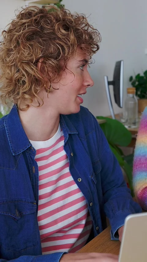 Two young diverse female students working together on laptop at home Stock Footage 346598469