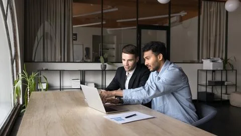 Two young diverse project managers men working on startup Stock Photos
