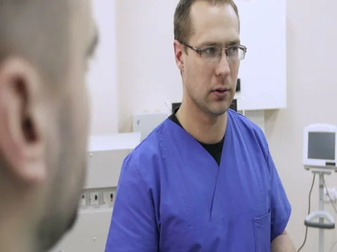 Two young doctors discussing the history of the patient Stock Footage 73094893