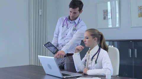 Two young doctors having a discussion Stock Footage 25129347