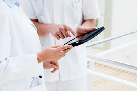 Two young doctors using digital tablet Stock Photos