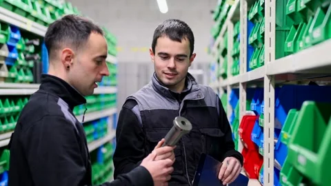 Two young employees working in a storehouse Video stock 262012049