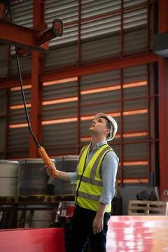 Two young engineers Testing and checking the operation of the semi gantry ... Stock Photos