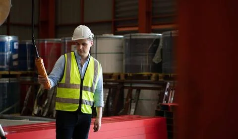 Two young engineers Testing and checking the operation of the semi gantry ... Stock Photos