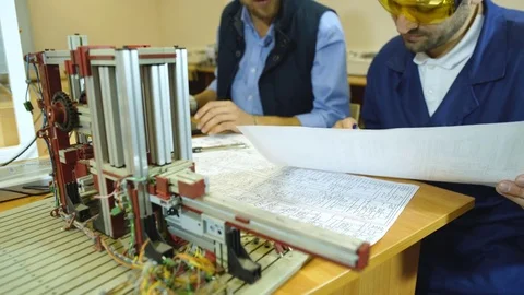 Two young engineers working on a project together in science lab Stock Footage 70799364