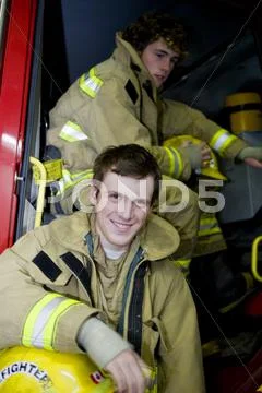 Two young firemen Stock Photos