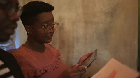 Two young freelancers having a discussion at the bar Stock Footage 155542546
