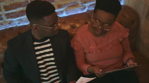 Two young freelancers working at a coffee shop Stock Footage 155541900