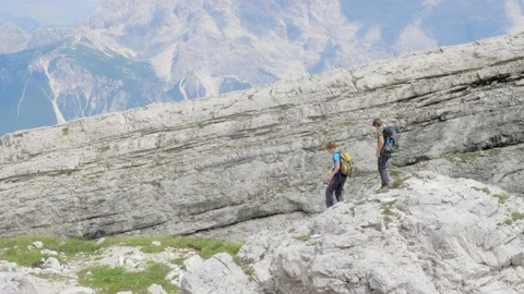 Two young friends explore in the mountains Stock Footage 177479132