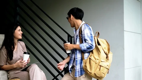 Two young friends joyful with talking together Stock Footage 106546202