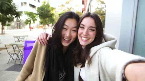 Two young friends taking selfie and having fun together Happy beautiful girls Stock Footage 240303374